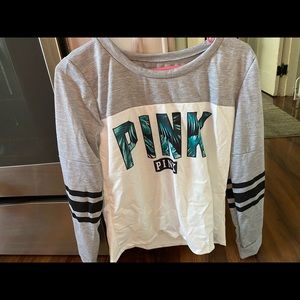 Pink long sleeve shirt.
